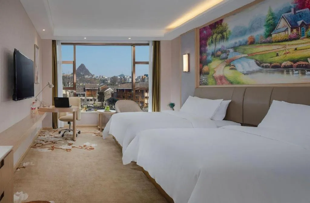 Bed in Vienna Hotel Guizhou Liupanshui Shuicheng Ancient Town