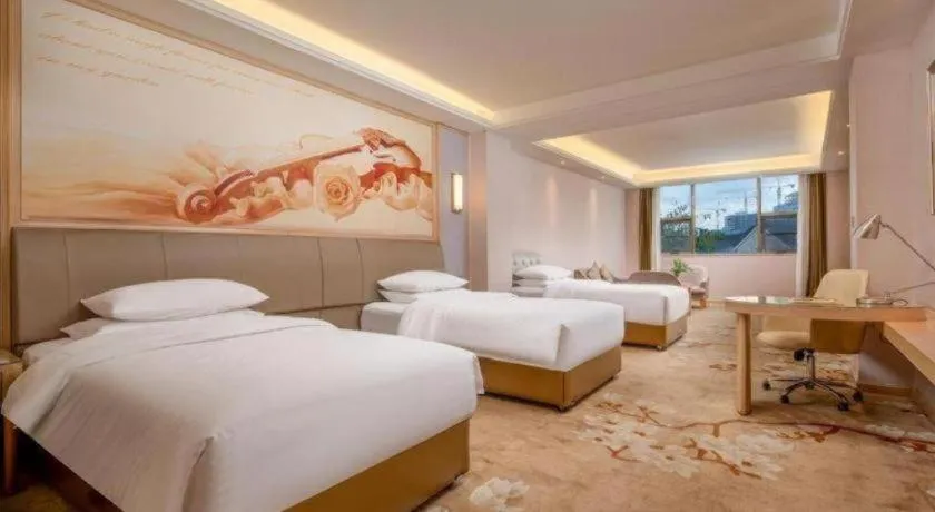 Bed in Vienna Hotel Guizhou Liupanshui Shuicheng Ancient Town