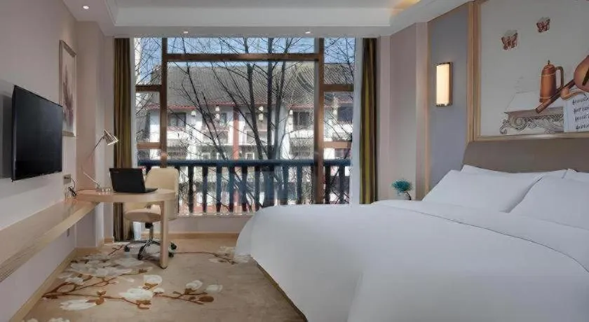 Bed in Vienna Hotel Guizhou Liupanshui Shuicheng Ancient Town