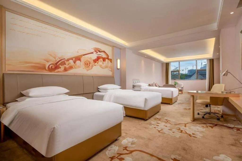 Bed in Vienna Hotel Guizhou Liupanshui Shuicheng Ancient Town