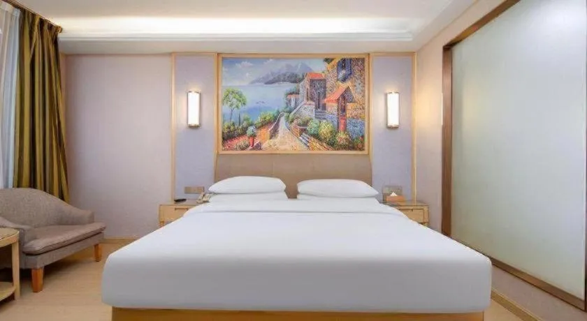 Bed in Vienna Hotel Guizhou Liupanshui Shuicheng Ancient Town