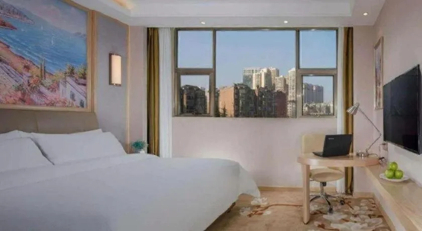 Bed in Vienna Hotel Guizhou Liupanshui Shuicheng Ancient Town