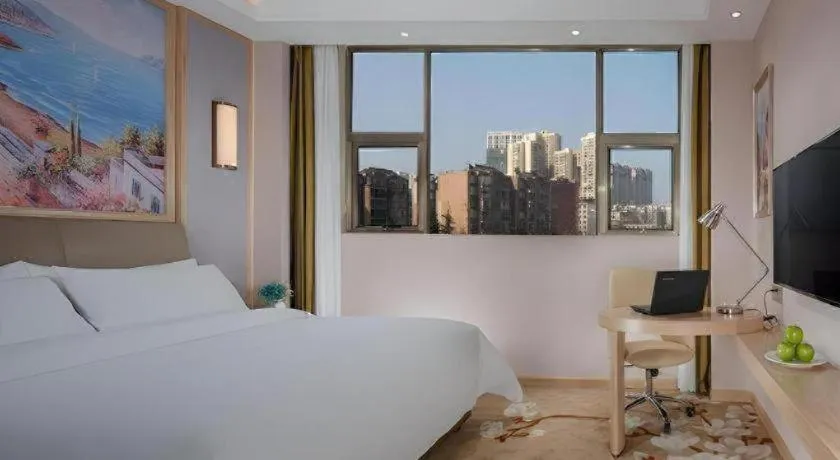 Bed in Vienna Hotel Guizhou Liupanshui Shuicheng Ancient Town