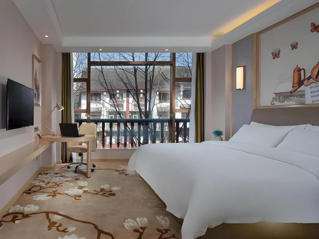 Bed in Vienna Hotel Guizhou Liupanshui Shuicheng Ancient Town
