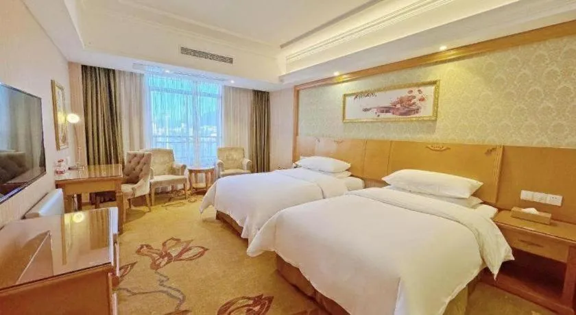 Bed in Vienna Hotel Guangxi Guilin Xing'an