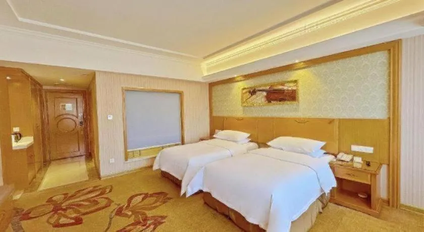 Bed in Vienna Hotel Guangxi Guilin Xing'an