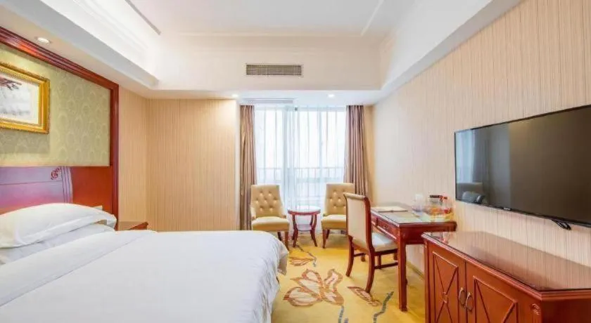 Bed in Vienna Hotel Guangxi Guilin Xing'an