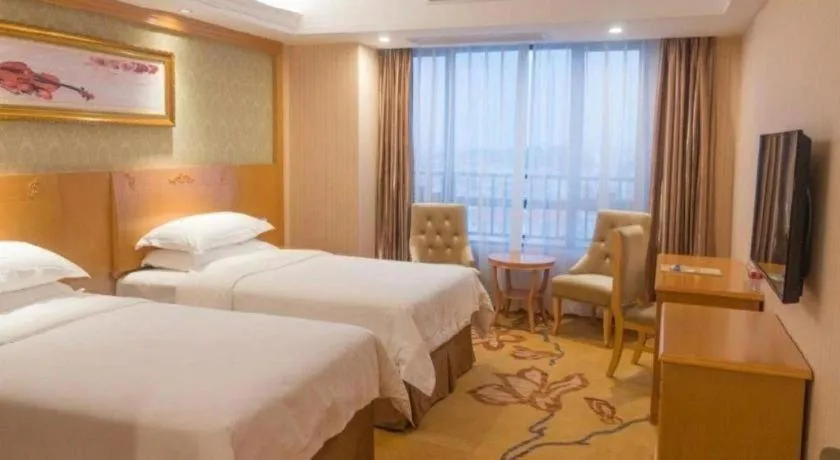 Bed in Vienna Hotel Guangxi Guilin Xing'an