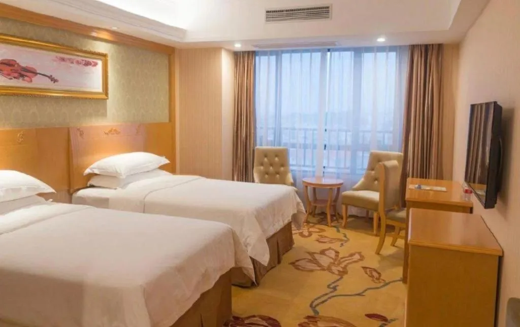 Bed in Vienna Hotel Guangxi Guilin Xing'an