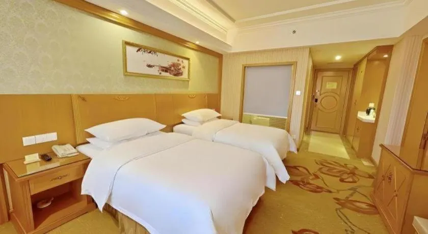 Bed in Vienna Hotel Guangxi Guilin Xing'an