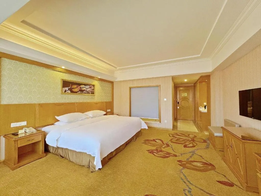 Bed in Vienna Hotel Guangxi Guilin Xing'an