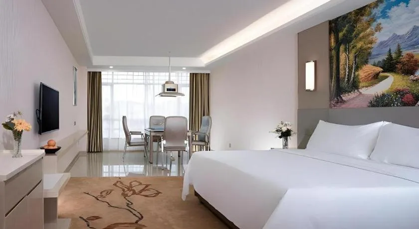 Bed in Vienna Hotel Guangdong Huizhou High-Speed North Railway Station Xiaojinkou