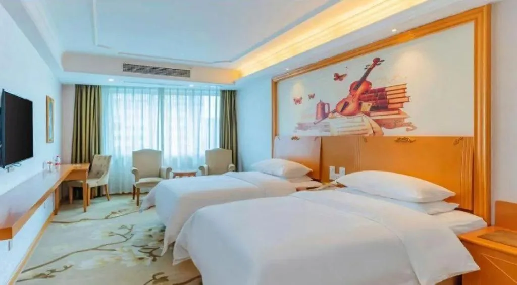 Bed in Vienna Hotel Guangdong Huizhou High-Speed North Railway Station Xiaojinkou