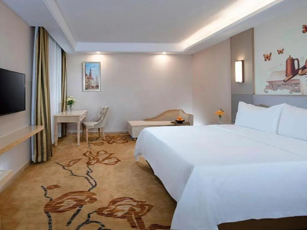 Bed in Vienna Hotel Guangdong Huizhou High-Speed North Railway Station Xiaojinkou