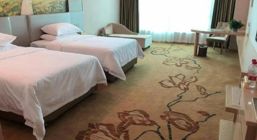 Bed in Vienna Hotel Guangdong Huizhou High-Speed North Railway Station Xiaojinkou
