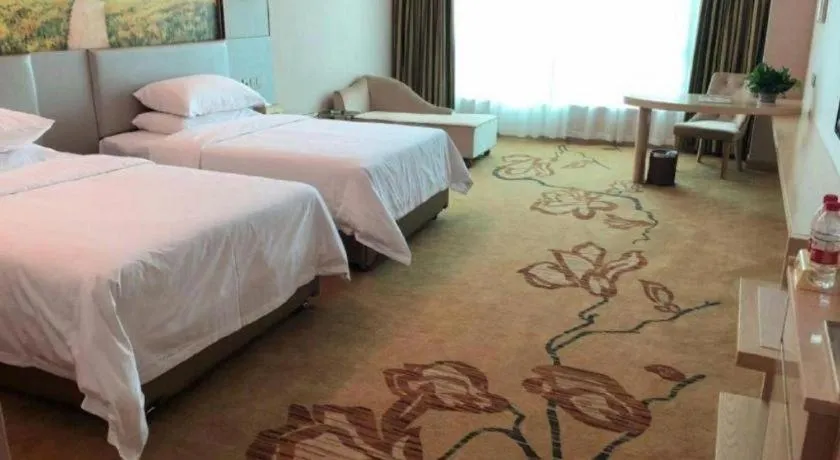 Bed in Vienna Hotel Guangdong Huizhou High-Speed North Railway Station Xiaojinkou