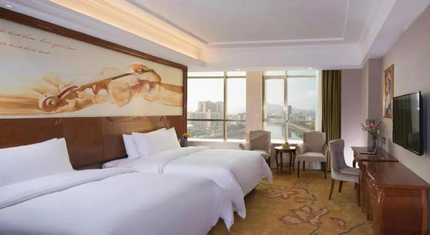 Bed in Vienna Hotel Guangdong Huizhou High-Speed North Railway Station Xiaojinkou