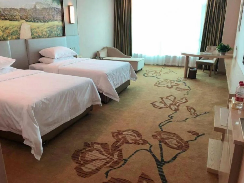 Bed in Vienna Hotel Guangdong Huizhou High-Speed North Railway Station Xiaojinkou
