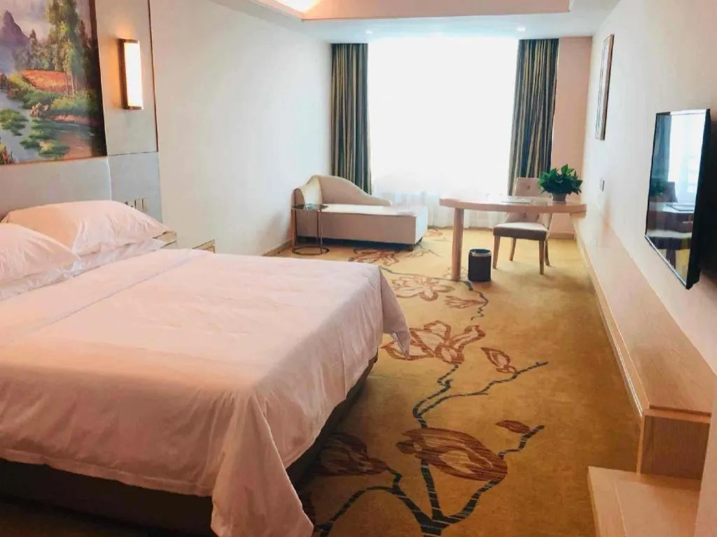 Bed in Vienna Hotel Guangdong Huizhou High-Speed North Railway Station Xiaojinkou