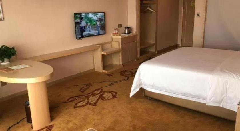 Bed in Vienna Hotel Guangdong Huizhou High-Speed North Railway Station Xiaojinkou