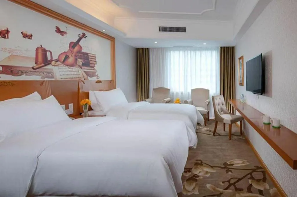 Bed in Vienna Hotel Guangdong Huizhou High-Speed North Railway Station Xiaojinkou