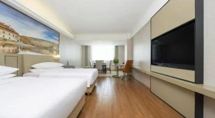 Bed in Vienna Hotel Yongzhou Dong'an High-Speed Railway Station