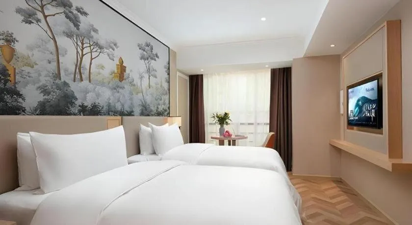 Bed in Vienna Hotel Yongzhou Dong'an High-Speed Railway Station