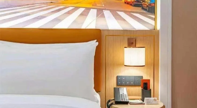 Bed in Vienna Hotel Yongzhou Dong'an High-Speed Railway Station