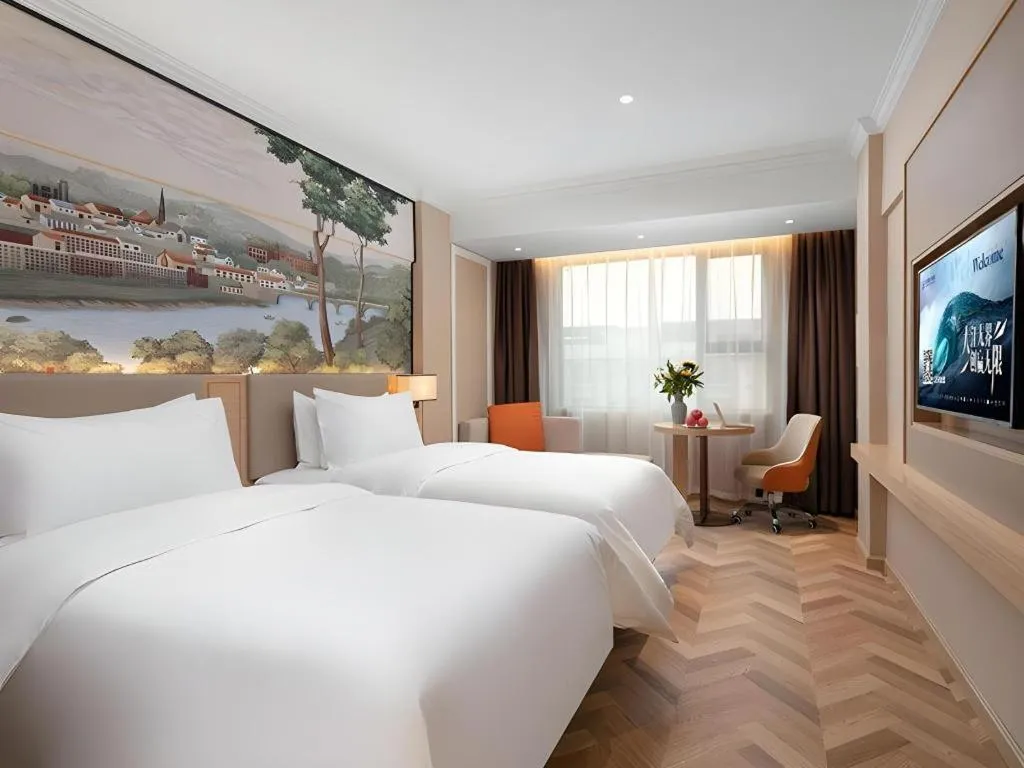 Bed in Vienna Hotel Yongzhou Dong'an High-Speed Railway Station