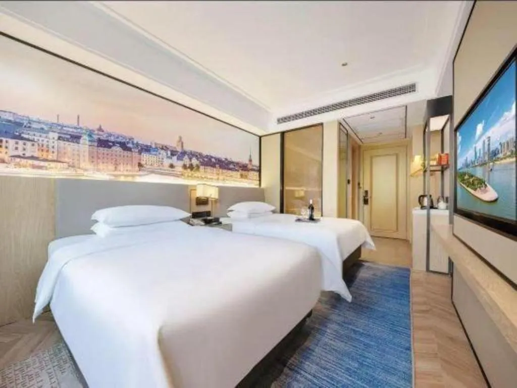 Bed in Vienna Hotel Yongzhou Dong'an High-Speed Railway Station