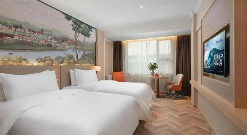 Bed in Vienna Hotel Yongzhou Dong'an High-Speed Railway Station