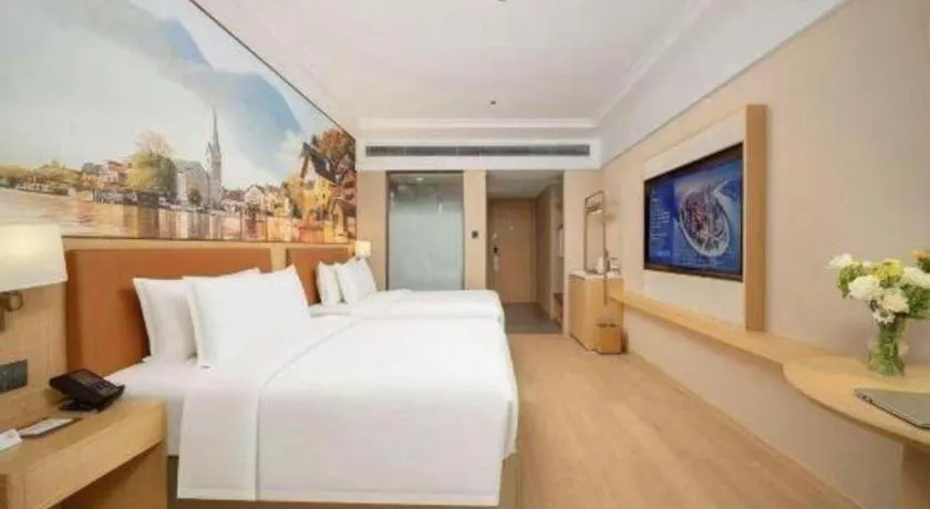 Bed in Vienna Hotel Yongzhou Dong'an High-Speed Railway Station