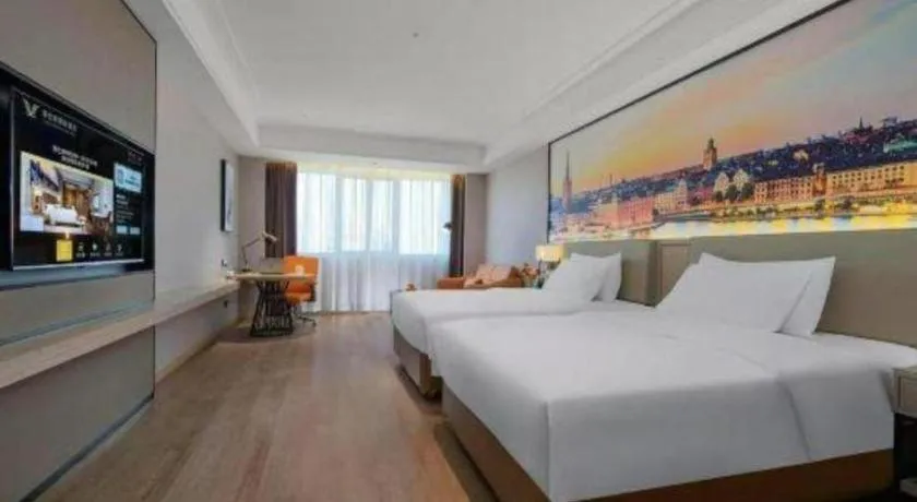 Bed in Vienna Hotel Yongzhou Dong'an High-Speed Railway Station