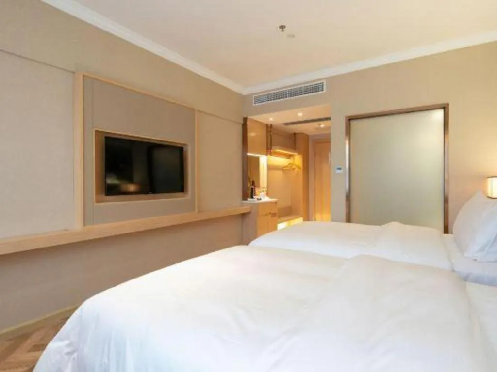 Bed in Vienna Hotel Yongzhou Dong'an High-Speed Railway Station