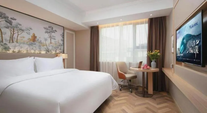 Bed in Vienna Hotel Yongzhou Dong'an High-Speed Railway Station