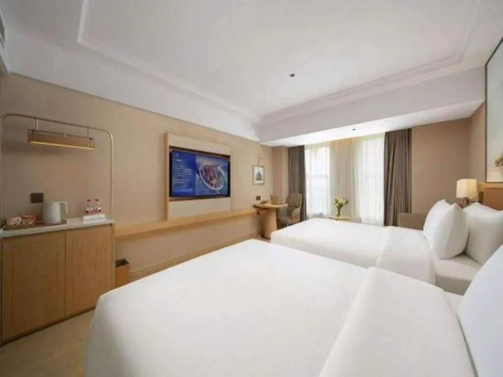 Bed in Vienna Hotel Yongzhou Dong'an High-Speed Railway Station