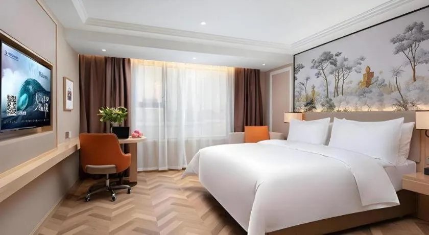 Bed in Vienna Hotel Yongzhou Dong'an High-Speed Railway Station