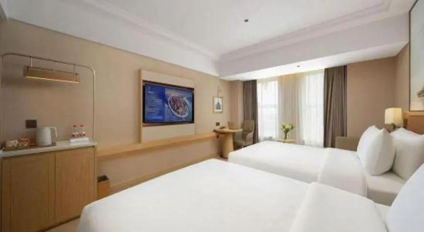 Bed in Vienna Hotel Yongzhou Dong'an High-Speed Railway Station