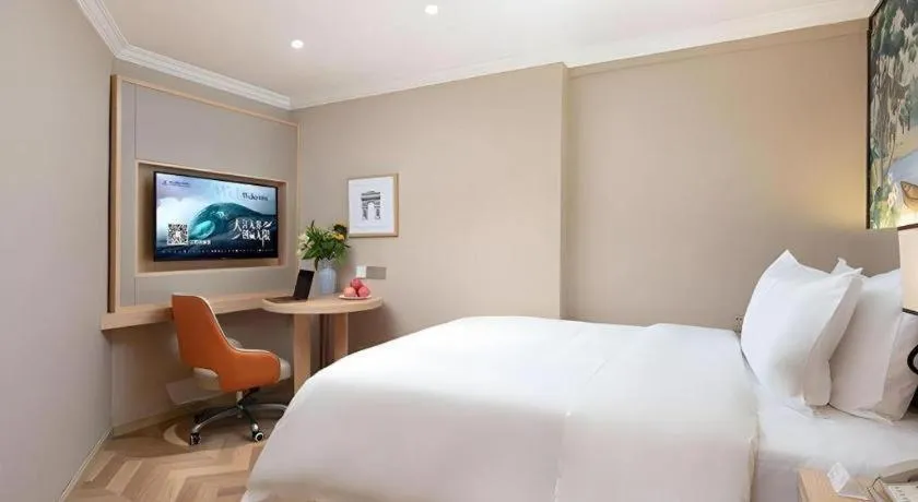 Bed in Vienna Hotel Yongzhou Dong'an High-Speed Railway Station