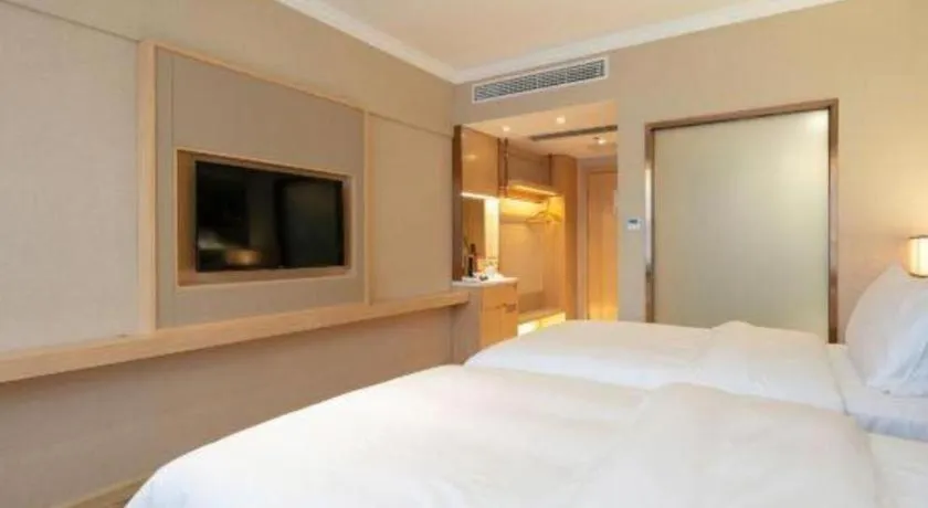 Bed in Vienna Hotel Yongzhou Dong'an High-Speed Railway Station