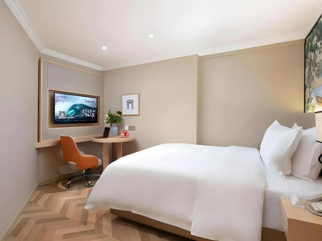 Bed in Vienna Hotel Yongzhou Dong'an High-Speed Railway Station