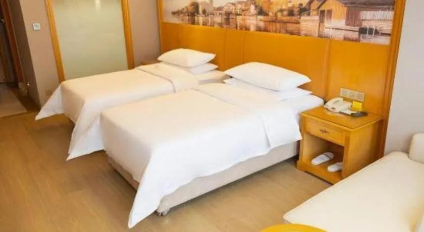 Bed in Vienna Hotel Henan Luoyang Jiudu Road Wanda