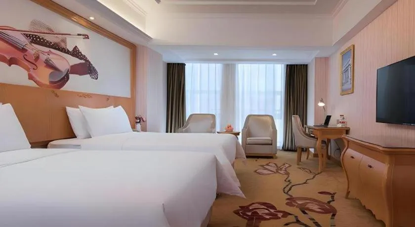 Bed in Vienna Hotel Henan Luoyang Jiudu Road Wanda