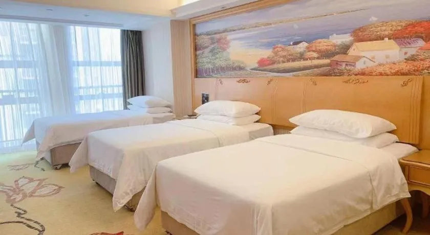 Bed in Vienna Hotel Henan Luoyang Jiudu Road Wanda