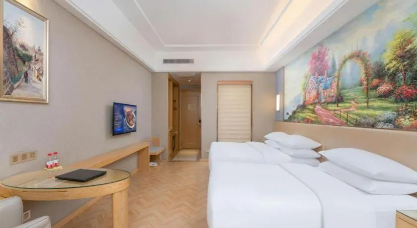 Bed in Vienna Hotel Jiangsu Zhangjiagang Passenger Terminal Station