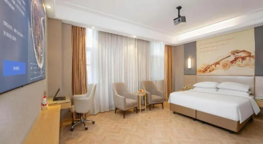 Bed in Vienna Hotel Jiangsu Zhangjiagang Passenger Terminal Station