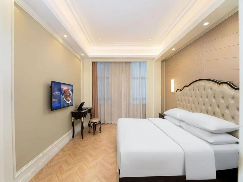 Bed in Vienna Hotel Jiangsu Zhangjiagang Passenger Terminal Station