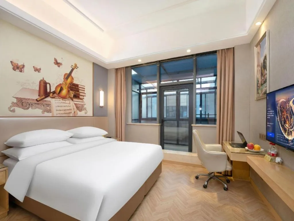 Bed in Vienna Hotel Jiangsu Zhangjiagang Passenger Terminal Station