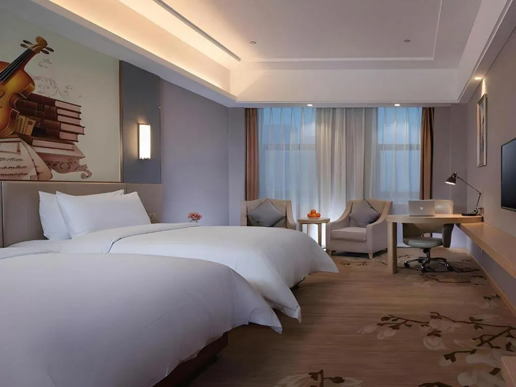 Bed in Vienna Hotel Jiangsu Zhangjiagang Passenger Terminal Station