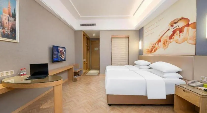 Bed in Vienna Hotel Jiangsu Zhangjiagang Passenger Terminal Station